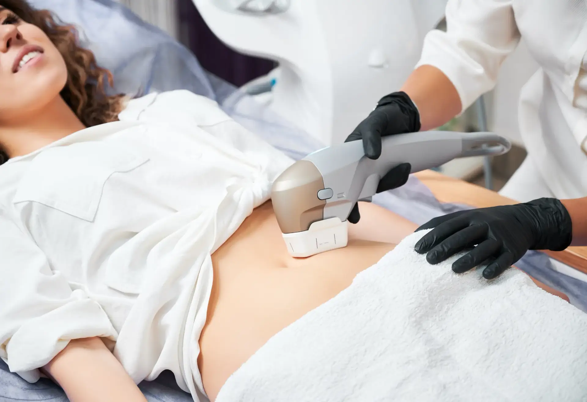 A body contouring treatment being delivered to a reclined patient at a South Tempe, AZ clinic