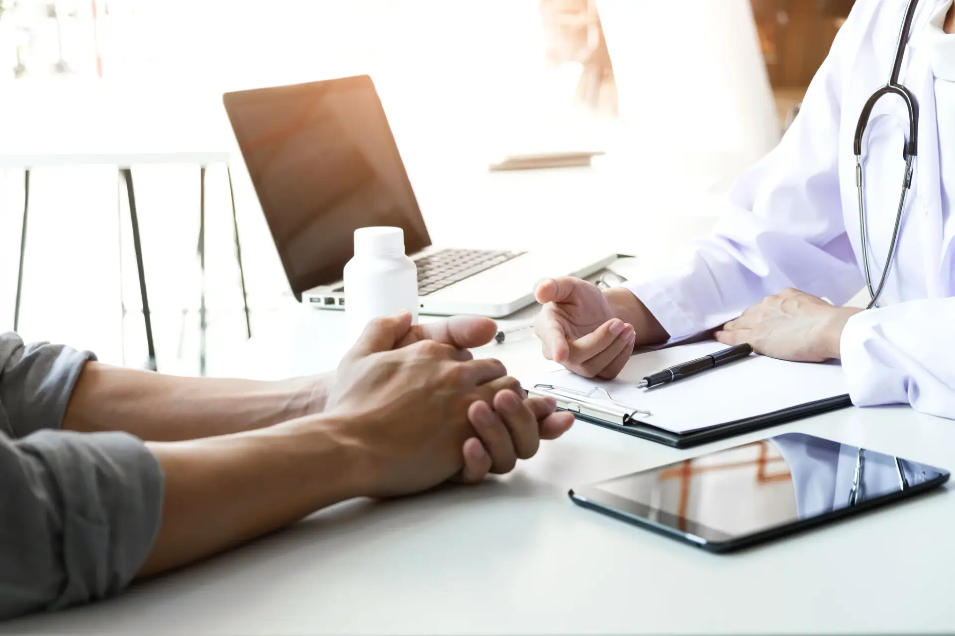 A naturopathic physician reviewing a patient's history in South Tempe, AZ