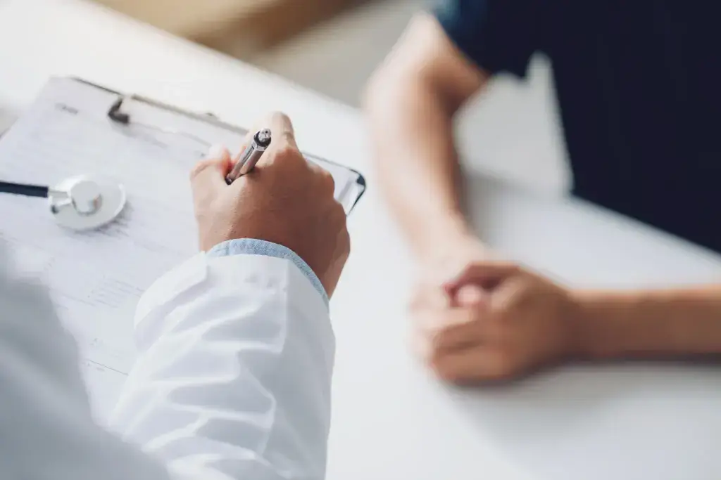 A naturopathic physician reviewing an environmental exposure history with a patient in South Tempe, AZ