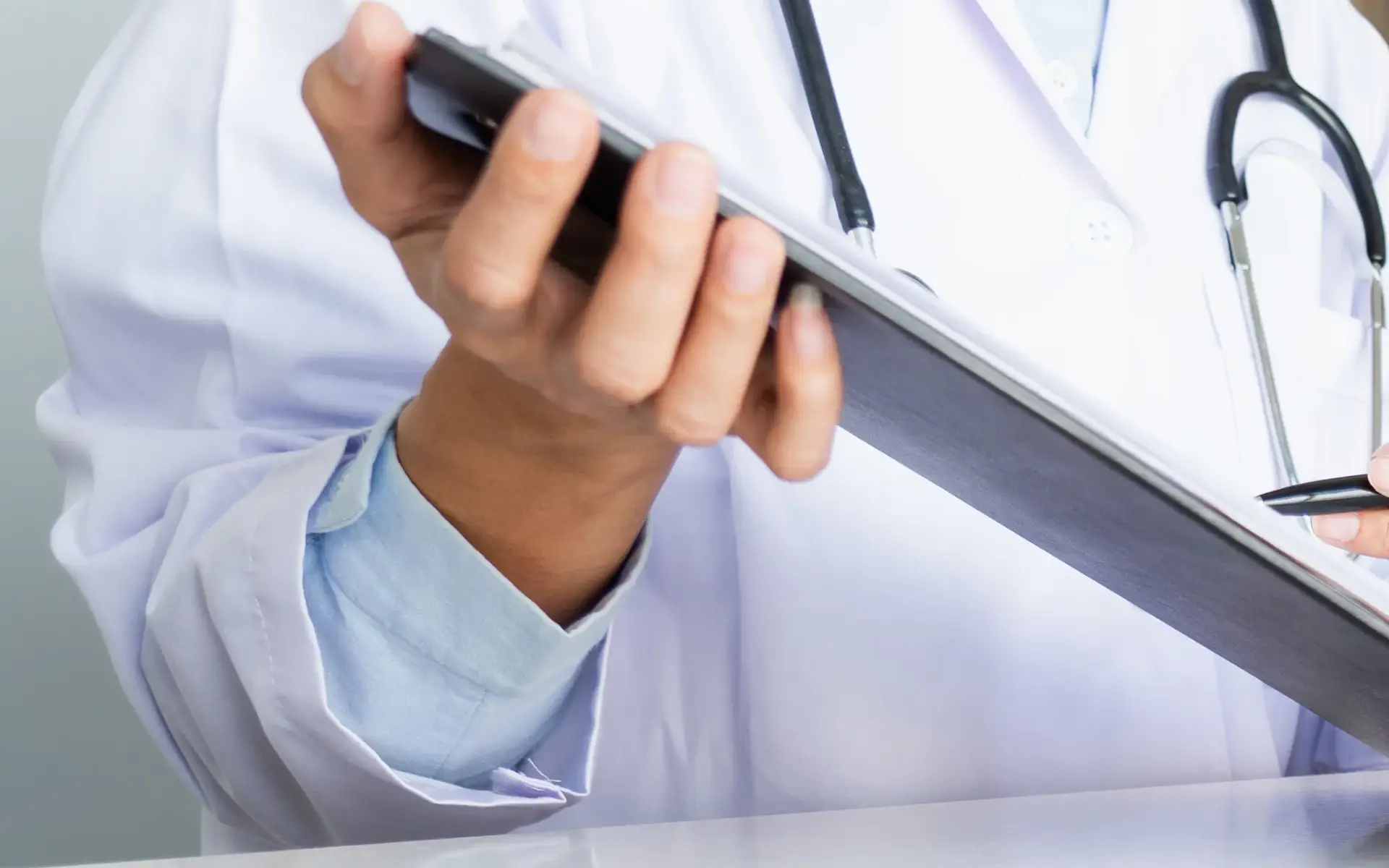 A naturopathic physician reviewing a patient's hormone history and lab notes in South Tempe, AZ