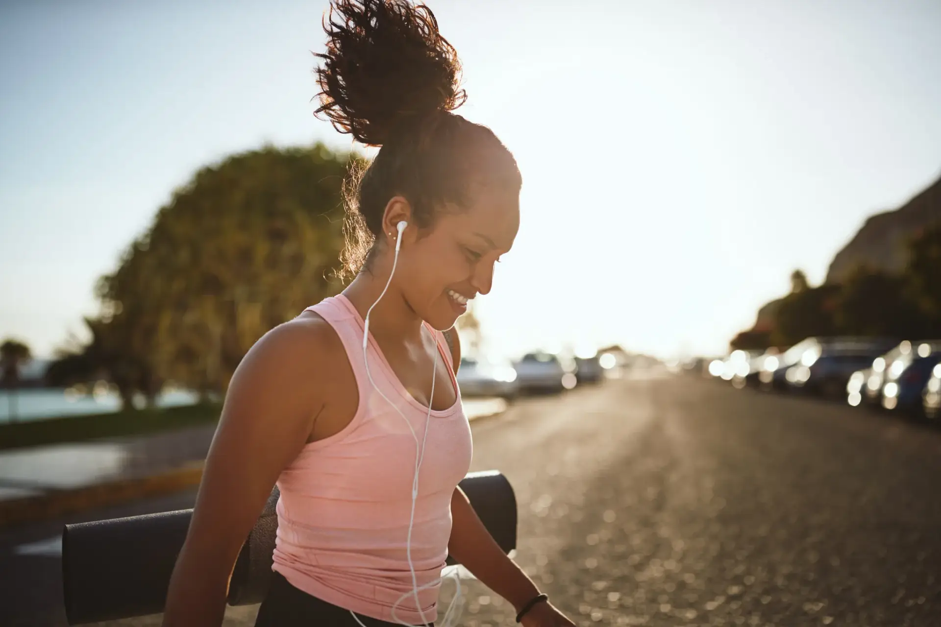 A woman lacing up for an early run, the everyday energy hormone care aims to support in South Tempe, AZ