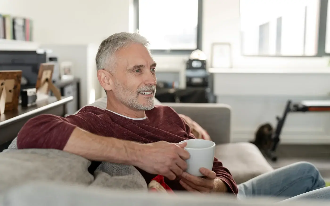 Relaxed, confident mature man on his sofa, P-Shot sexual wellness care in South Tempe, AZ
