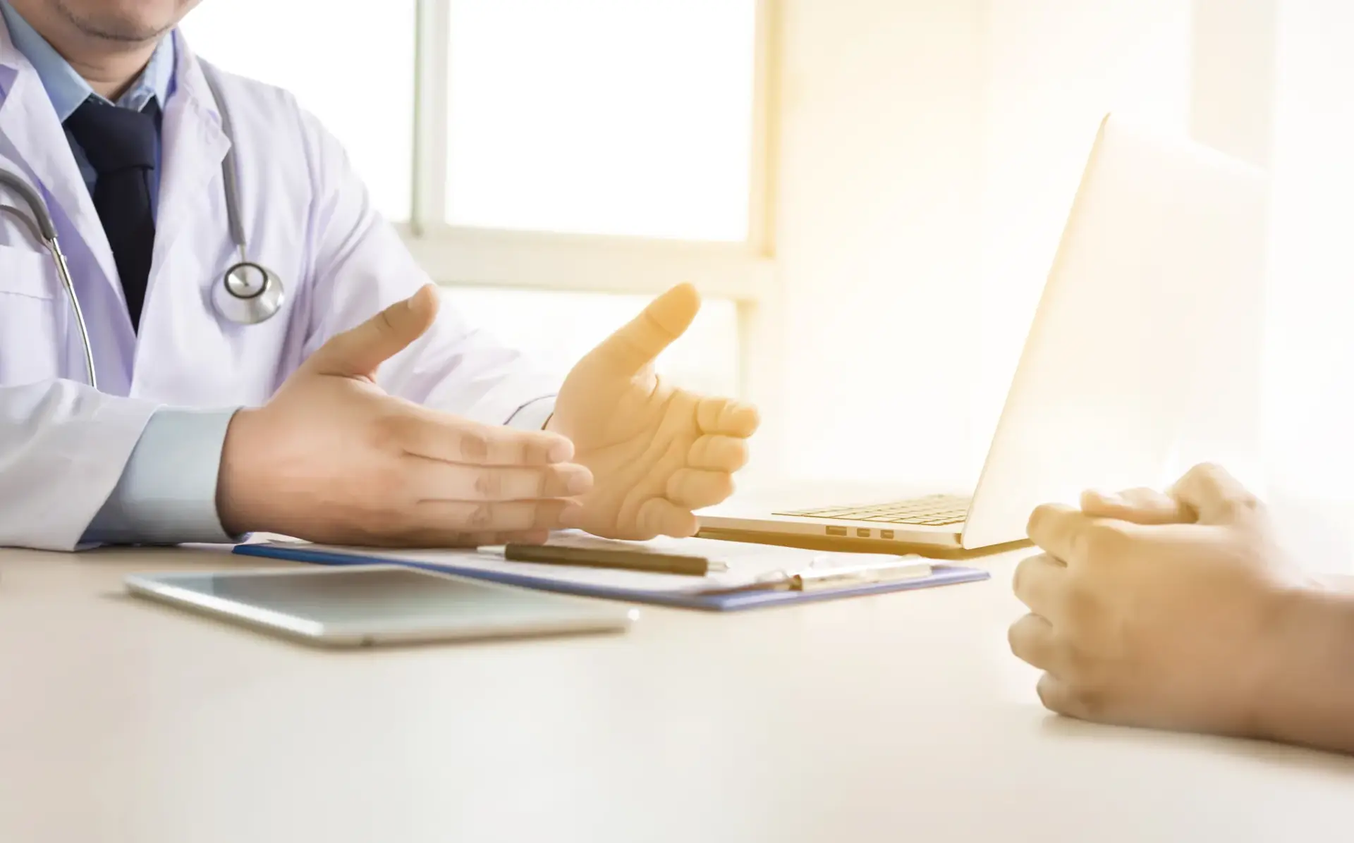 A naturopathic physician taking a full history from a male patient in South Tempe, AZ