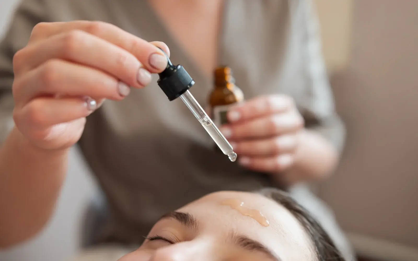 Treatment serum being applied to the skin during a microneedling session in South Tempe, AZ