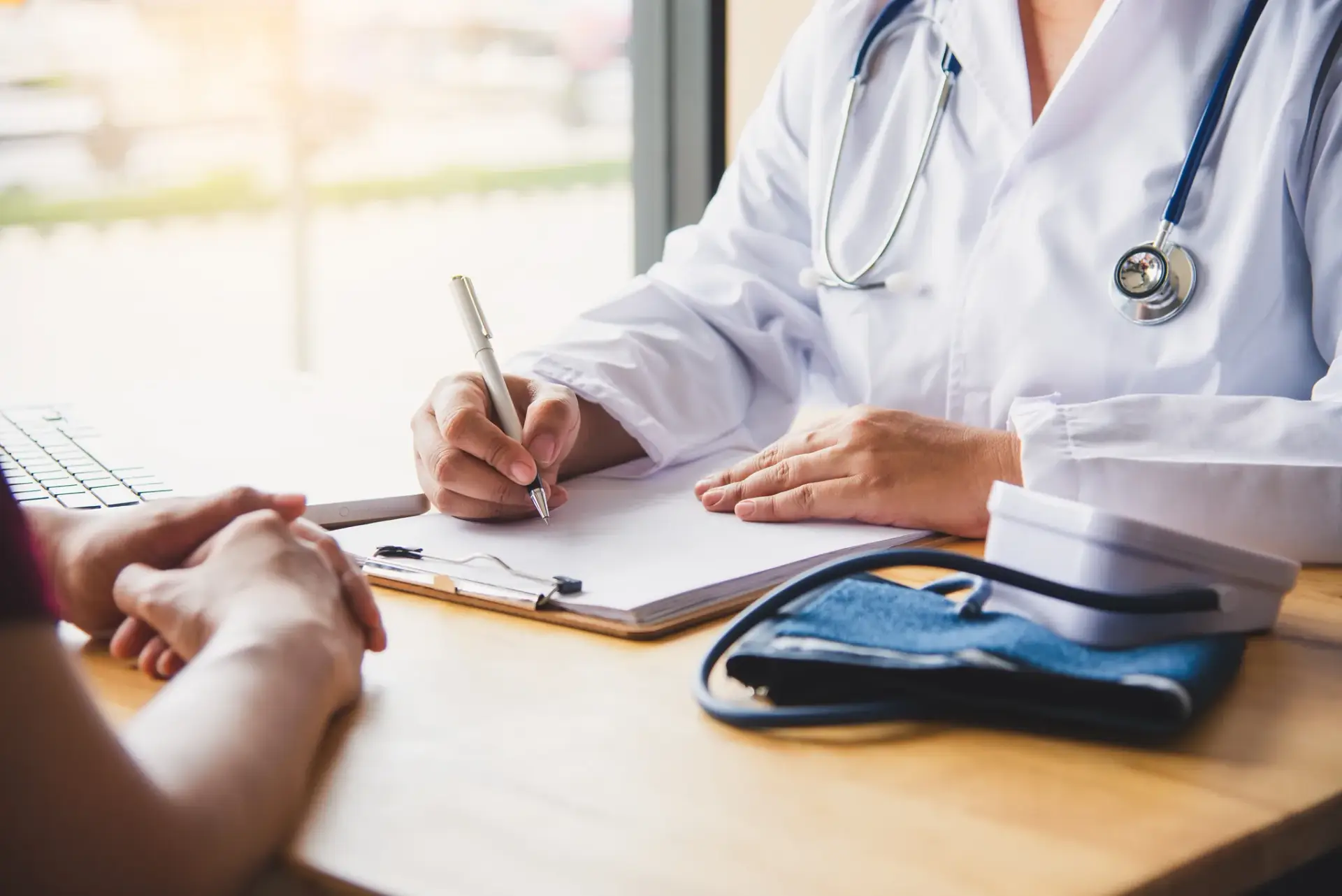 A naturopathic physician reviewing progress with a patient after PEMF therapy in South Tempe, AZ