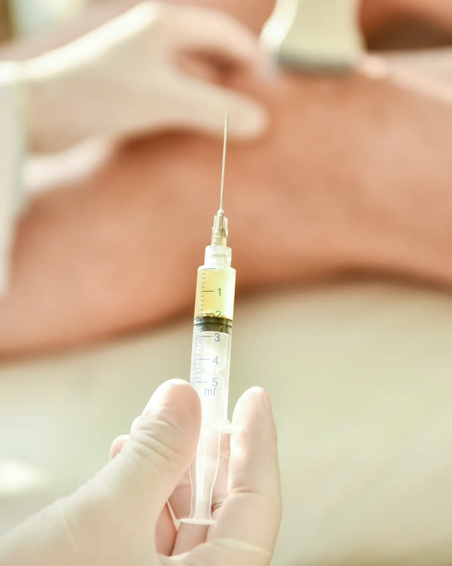 A physician performing a regenerative injection into a patient knee in South Tempe, AZ
