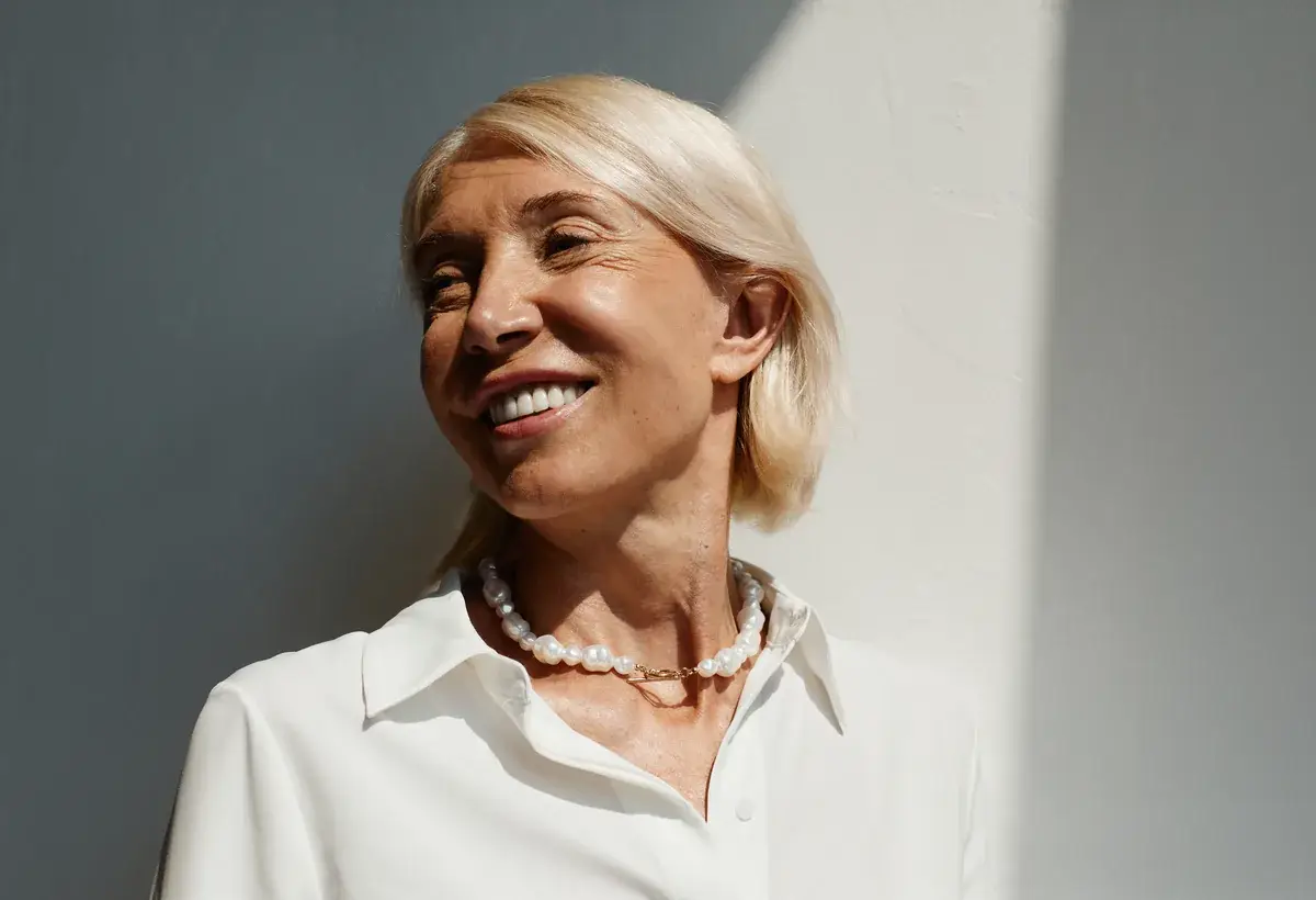 Confident woman in her fifties in natural light, representing intimate wellness care during menopause in South Tempe, AZ