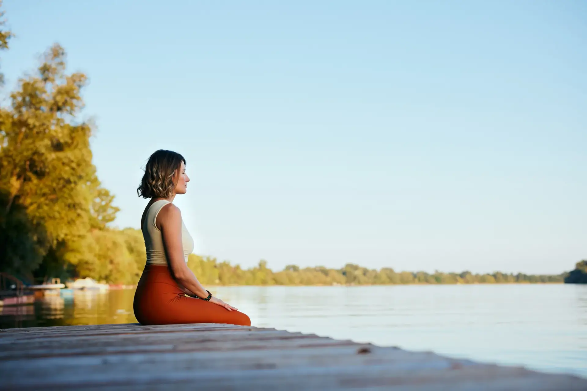 A woman in athletic wear taking a quiet moment outdoors near South Tempe, AZ